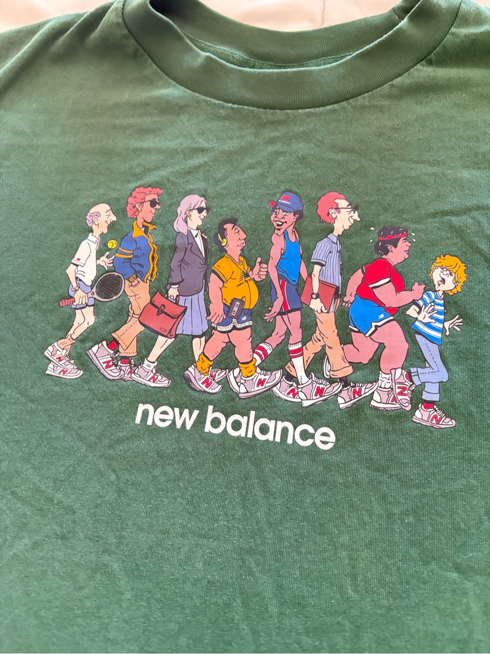New Balance Green Tee with Colorful Walking Characters